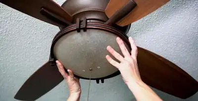 Ceiling fan repair and reinstallation on ceiling mount in Long Beach, CA