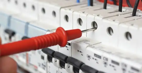 Electrical contractor testing circuit breakers during electrical repair in Rancho Palos Verdes, CA