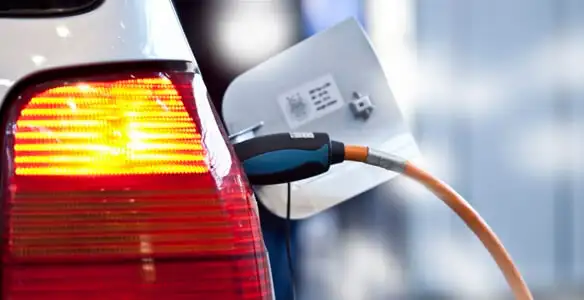Electric car plugged into EV charger after professional installation in Long Beach, CA
