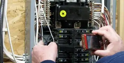 Home electrical inspection of circuit breaker panel by licensed electrician in Long Beach, CA