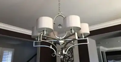 Modern chandelier installation with multiple light fixtures in Long Beach, CA