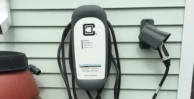 Outdoor electric vehicle charger installation on residential wall in Long Beach, CA