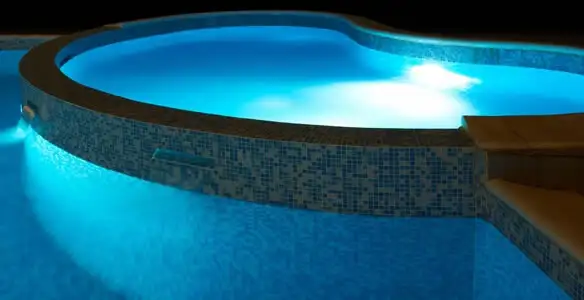 pool light installation and repair services highlighting illuminated pool interior lighting in Long Beach, CA