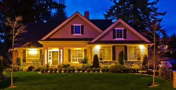 security light installation services illuminating a residential exterior at night in Long Beach, CA