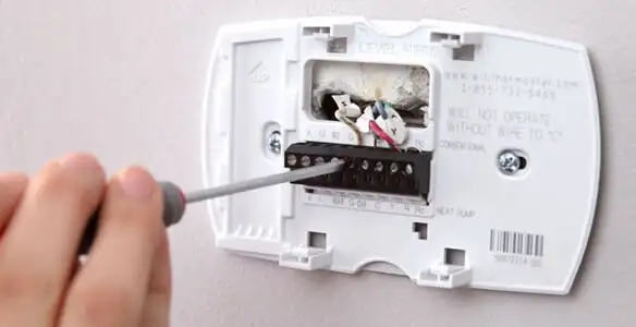Thermostat installation service with proper wiring and secure wall mounting in Long Beach, CA