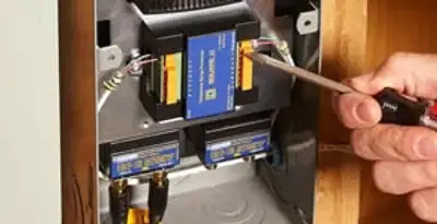 Whole home surge protection device being installed by a licensed electrician to protect electrical systems in Long Beach, CA